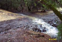 After: Armored fill crossing conveying streamflow shortly after completion of construction