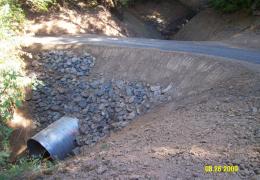 After: The new culvert is set at the natural channel gradient and is sized to accomodate both fish passage and peak flows 