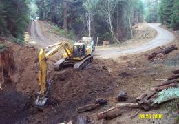 During: The upstream channel had been filled with soil and slash during historic logging. Note stump on left being exhumed.