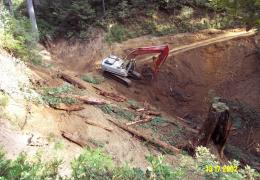 During: An excavator is used to remove fill from the crossing and re-establish the natural channel gradient