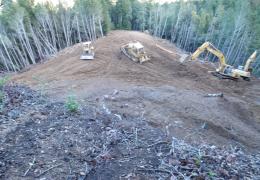 During: Heavy equipment is used to recontour the hillslope and prevent future sediment delivery to Outlet Creek.