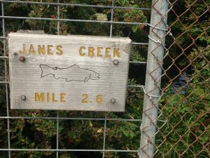 Janes Creek mile marker at a stream crossing in Arcata, CA.