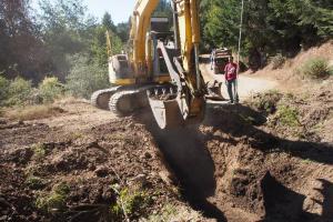 Installing a new stream crossing culvert in the Sheephouse Creek watershed.