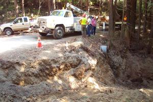 Installed in 1984, the existing culvert was short, undersized and set too high in the road fill.