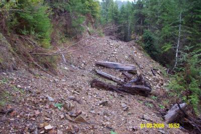 After: Unstable road fill has been excavated and most of it endhauled off-site to a stable spoil disposal site