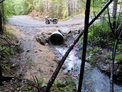 After: The crossing has been upgraded with a culvert sized for 100-yr peak flows & a critical dip to prevent stream diversion