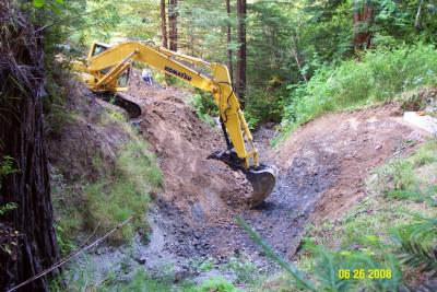 During: The stream crossing is excavated to the natural channel grade, with stable sideslopes. Note one concrete abutment