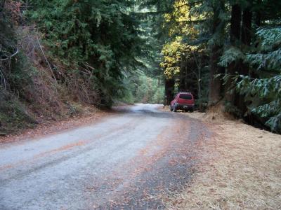 After: Outsloping and berm removal improves road drainage, disperses runoff, and reduces road surface erosion