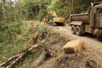 Before: Abandoned road on the steep inner gorge slope of a salmonid stream has been reopened to excavate unstable fillslopes 