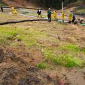 CCC crew members implement emergency erosion control measures under PWA supervision, Cummings Road Landfill.