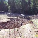 Poorly-designed surface drainage configuration led to significant erosion at this hilltop vineyard.