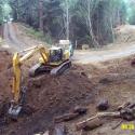 During: The upstream channel had been filled with soil and slash during historic logging. Note stump on left being exhumed.